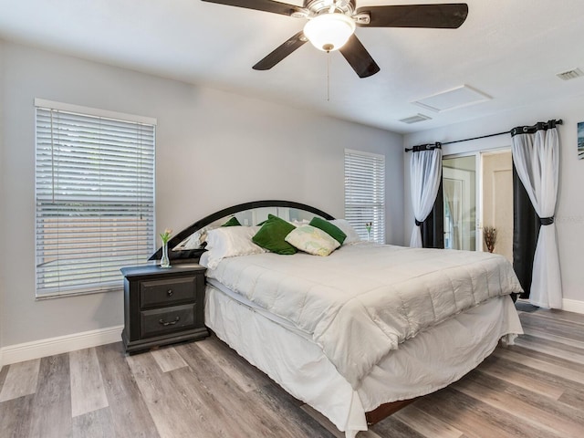 bedroom with ceiling fan and light wood-type flooring