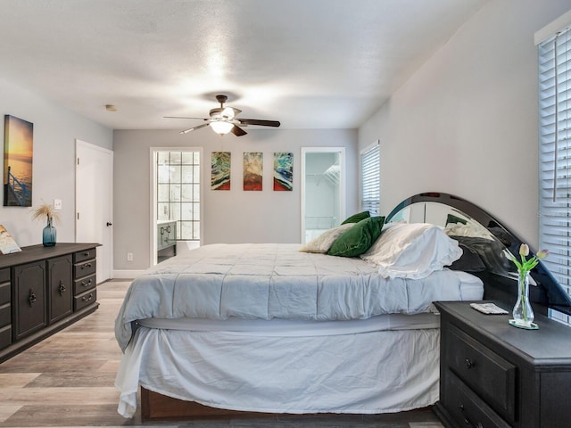 bedroom featuring light hardwood / wood-style floors and ceiling fan