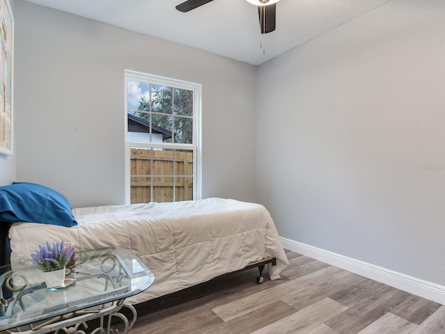 bedroom featuring light hardwood / wood-style flooring and ceiling fan