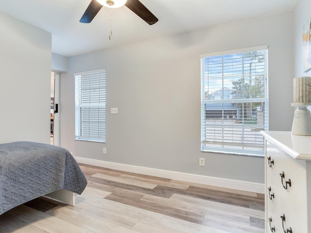 bedroom featuring ceiling fan and light hardwood / wood-style flooring