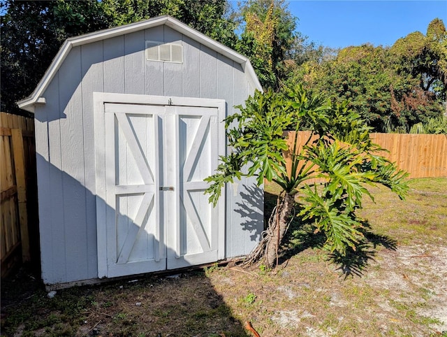 view of outbuilding featuring a yard