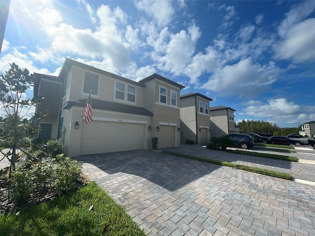 front of property with a garage