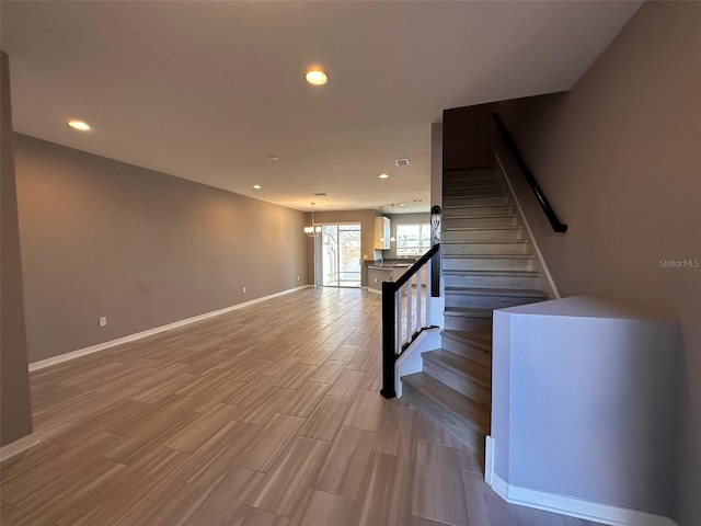 interior space with hardwood / wood-style flooring and a chandelier