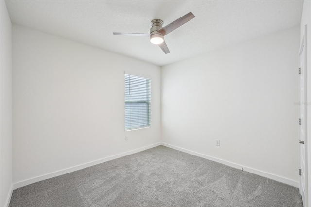 spare room with ceiling fan and carpet floors