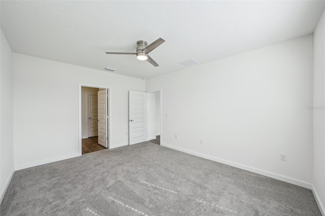 unfurnished bedroom featuring carpet and ceiling fan