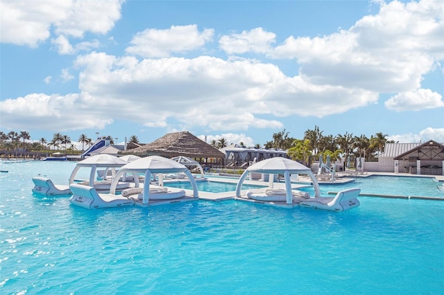 view of pool with a gazebo and pool water feature