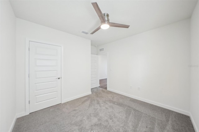 31814 Oyster Trellis Ln, Wesley Chapel, FL 33545 - unfurnished bedroom featuring carpet flooring, baseboards, and a ceiling fan
