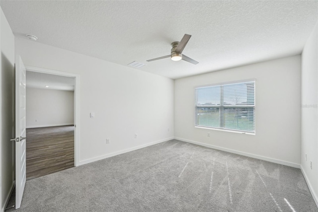 31814 Oyster Trellis Ln, Wesley Chapel, FL 33545 - unfurnished room with ceiling fan, a textured ceiling, carpet, baseboards, and a smoke detector