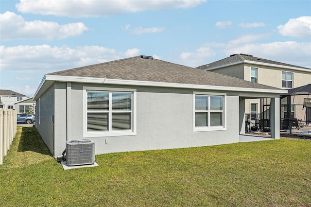 31814 Oyster Trellis Ln, Wesley Chapel, FL 33545 - rear view of house with central air condition unit, stucco siding, a patio, and roof with shingles