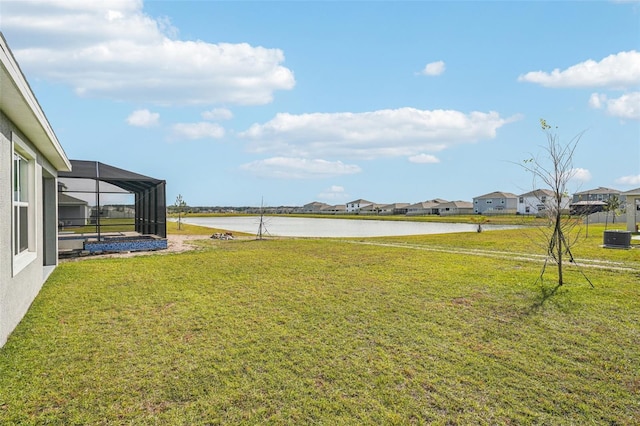 31814 Oyster Trellis Ln, Wesley Chapel, FL 33545 - view of grassy yard featuring a water view, cooling unit, a residential view, and glass enclosure