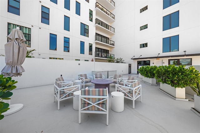 view of patio with an outdoor fire pit