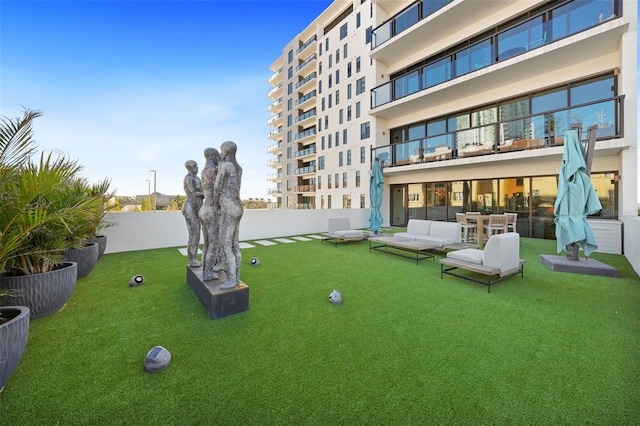 exterior space featuring a yard and an outdoor living space