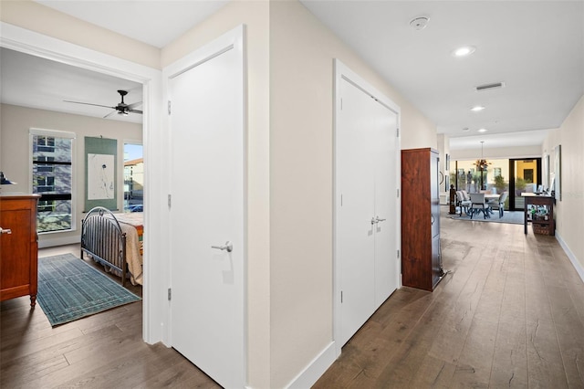 hallway featuring dark hardwood / wood-style floors