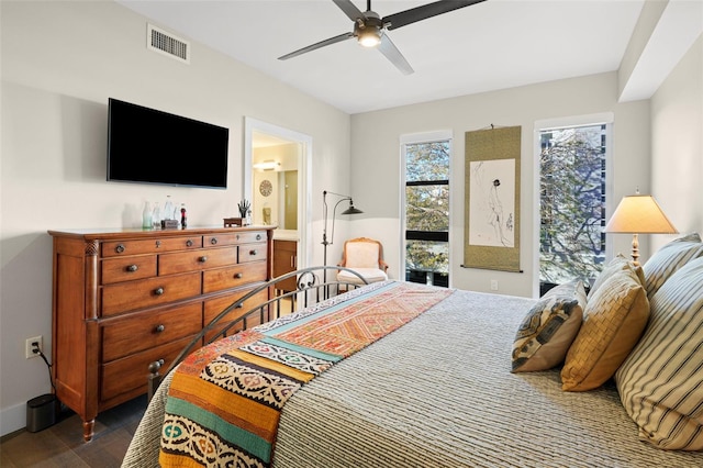 bedroom with ceiling fan and dark hardwood / wood-style floors