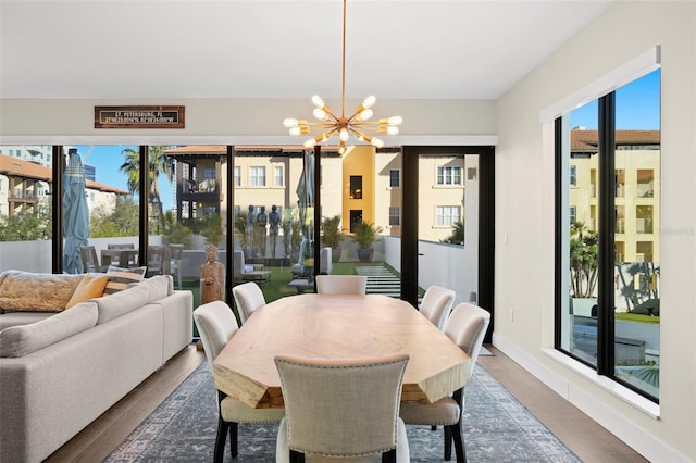 dining room featuring an inviting chandelier and hardwood / wood-style flooring