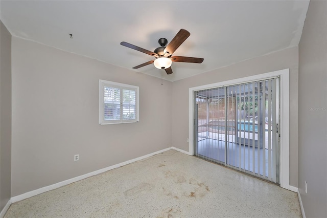 spare room with ceiling fan