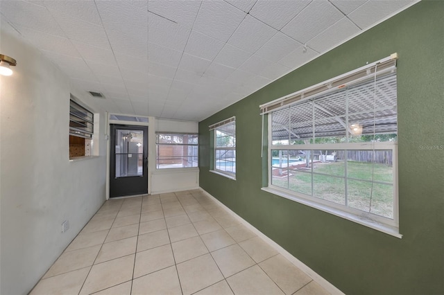 hallway featuring light tile patterned flooring