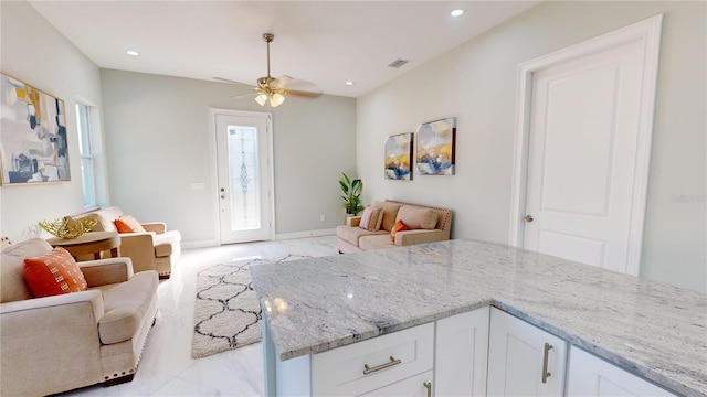 living room featuring ceiling fan