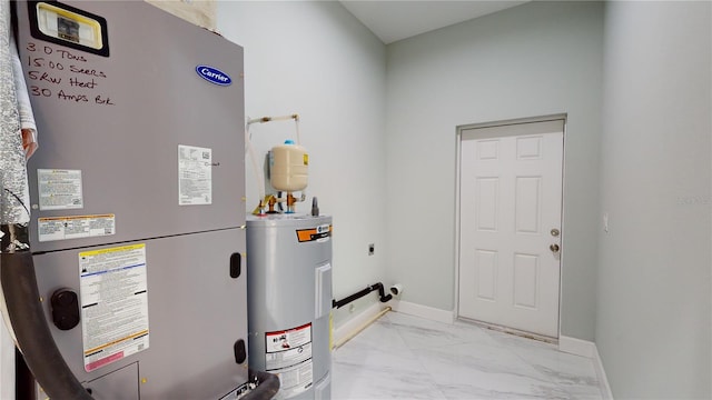 utility room featuring heating unit and water heater