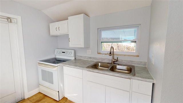 kitchen with lofted ceiling, sink, white cabinets, and electric stove