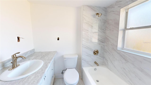 full bathroom with tiled shower / bath combo, vanity, and toilet