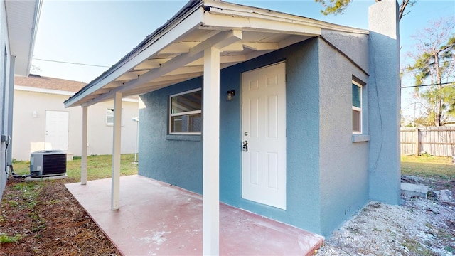 entrance to property featuring central AC unit