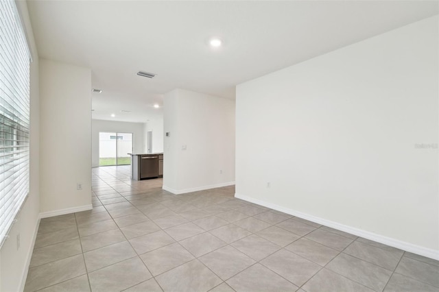 unfurnished room with light tile patterned floors