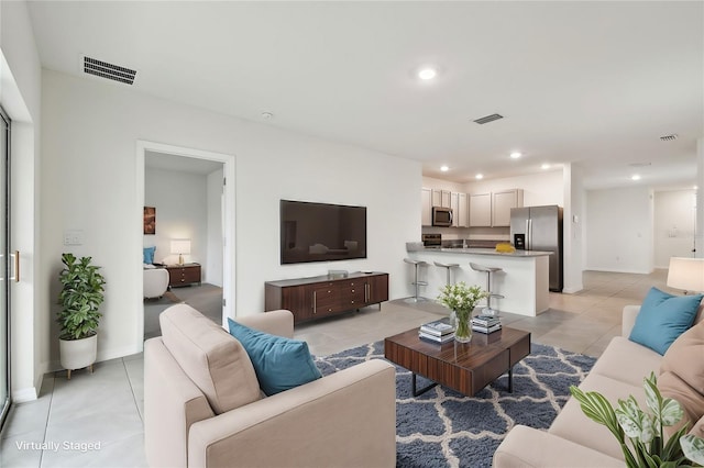 living room featuring light tile patterned flooring