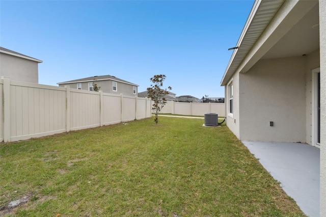 view of yard featuring a patio area and central AC