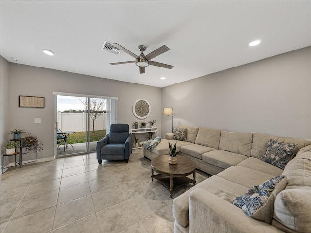 tiled living room with ceiling fan