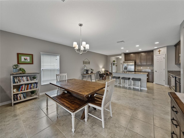 dining area featuring a chandelier