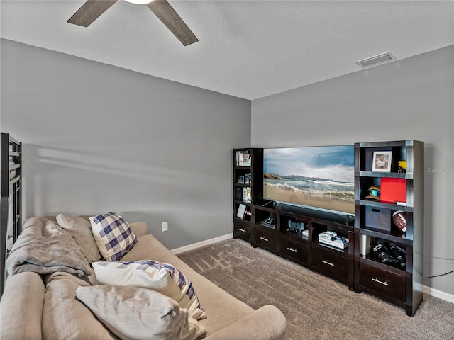 carpeted living room featuring a textured ceiling