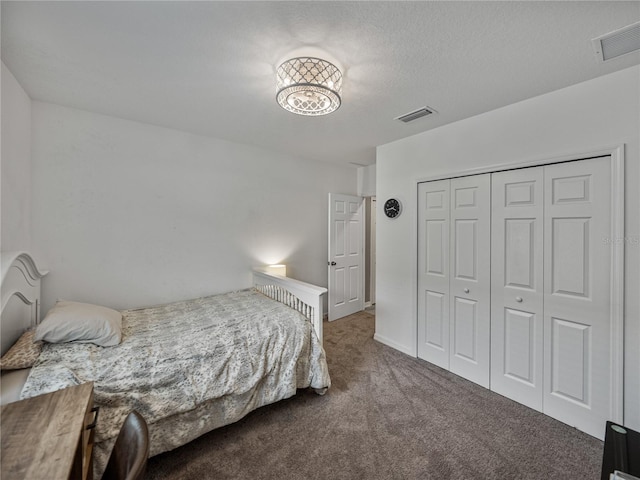 carpeted bedroom with a closet