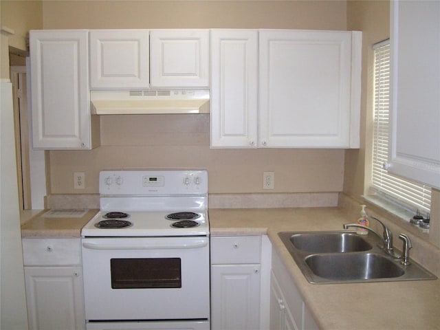 kitchen with sink, white cabinetry, and white electric range