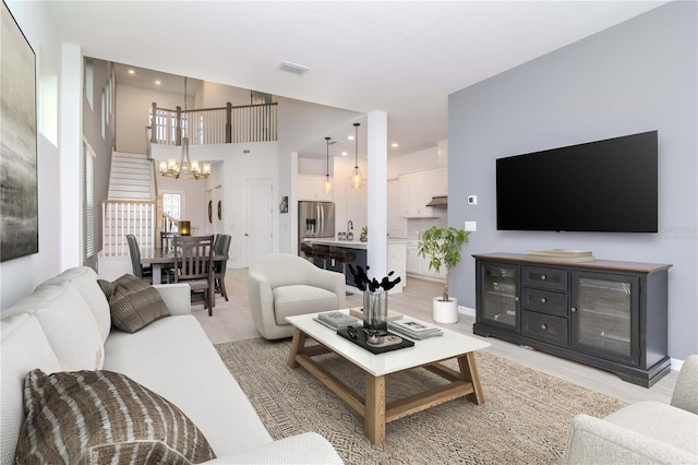 living room featuring a notable chandelier