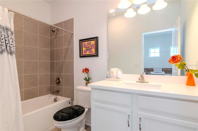 full bathroom with toilet, vanity, and shower / bath combination with curtain