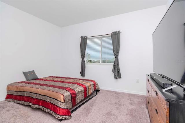 bedroom with light colored carpet