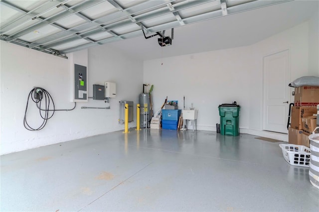 garage featuring a garage door opener, electric panel, water heater, and sink