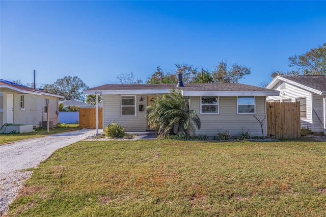 ranch-style house with central AC and a front yard