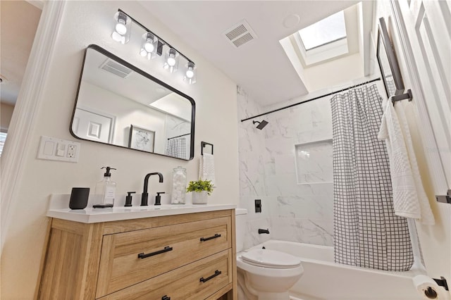 full bathroom with vanity, toilet, shower / bath combination with curtain, and a skylight