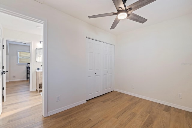 unfurnished bedroom featuring a closet, ceiling fan, and light hardwood / wood-style flooring