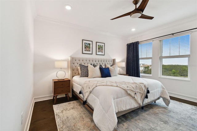 bedroom featuring crown molding, ceiling fan, and dark hardwood / wood-style flooring