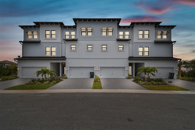 view of front of property with a garage