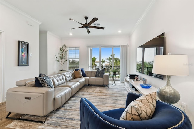 3027 Bermuda Sloop Cir, Ruskin, FL 33570 - living room featuring plenty of natural light, ornamental molding, ceiling fan, wood finished floors, and recessed lighting