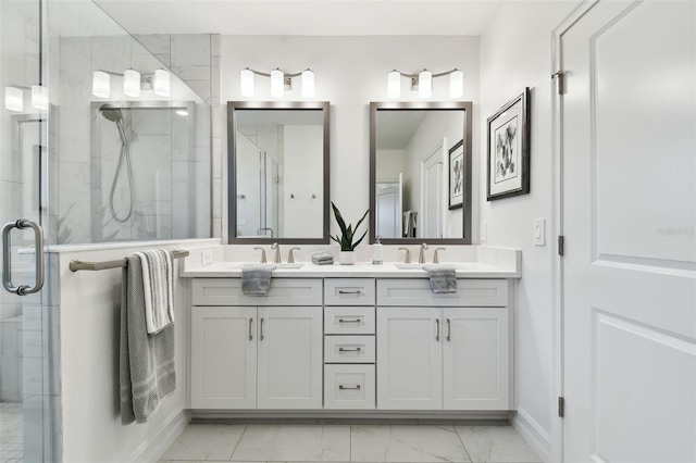3027 Bermuda Sloop Cir, Ruskin, FL 33570 - bathroom with marble look tiles, double vanity, a shower stall, and baseboards