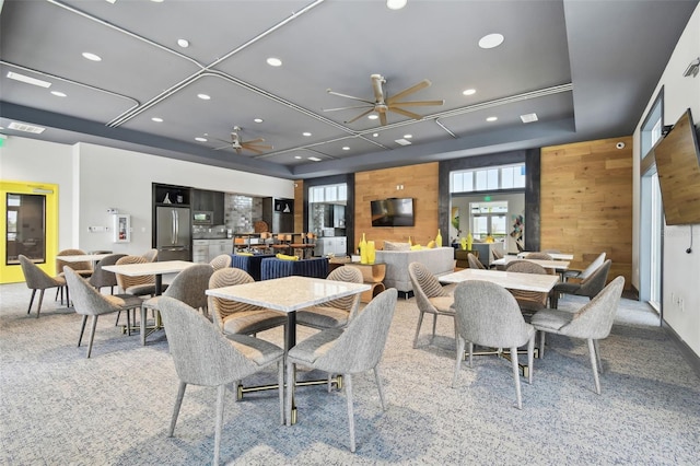 3027 Bermuda Sloop Cir, Ruskin, FL 33570 - dining area featuring a ceiling fan, carpet, recessed lighting, and wood walls