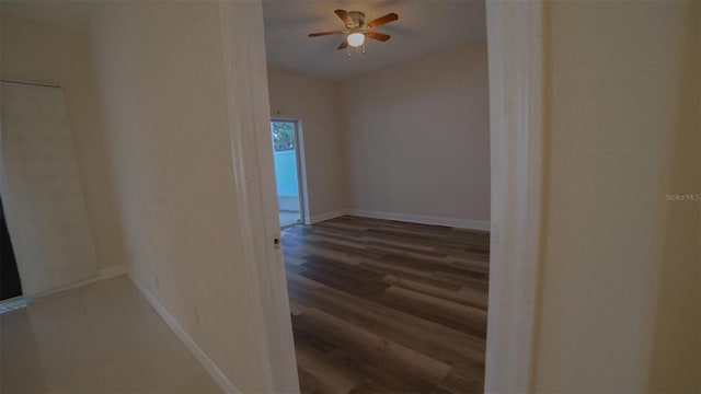 corridor with dark wood-type flooring