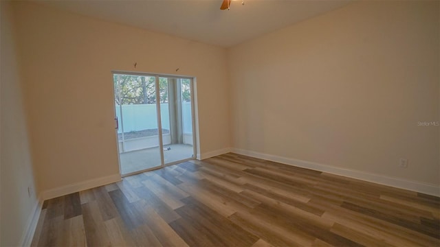 spare room with ceiling fan and hardwood / wood-style floors