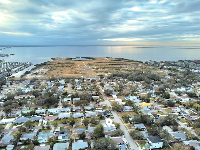 aerial view at dusk with a water view