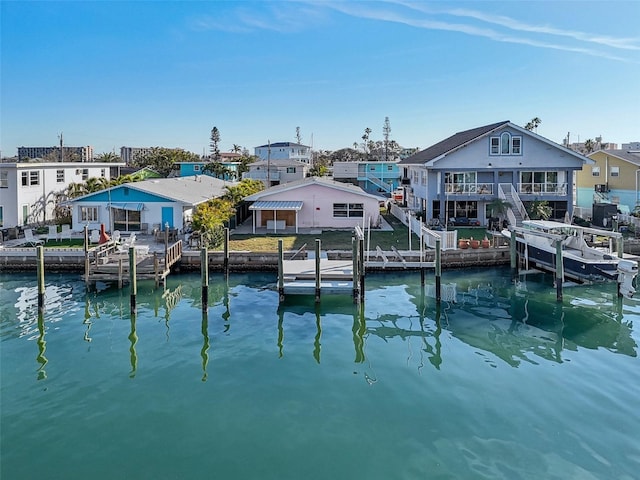 back of property with a water view